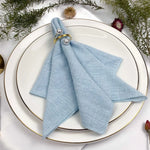 serviette lin bleu clair classique anneau métallique ruban coton fleur herbe séchée table mariage