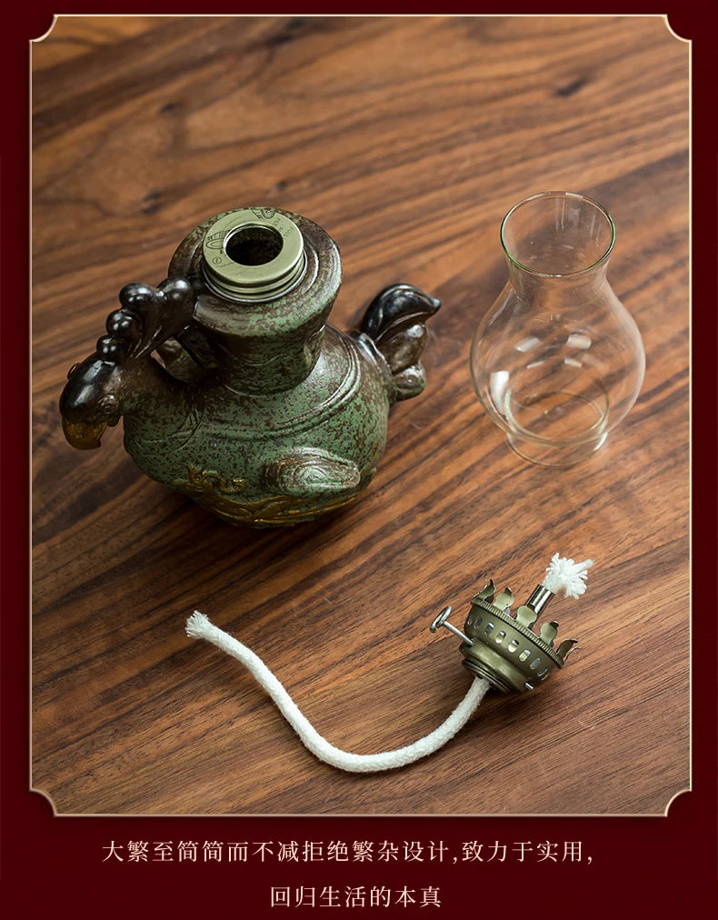 lampe huile vert verre transparent base grès doré oiseau stylisé vintage oriental décoration intérieure