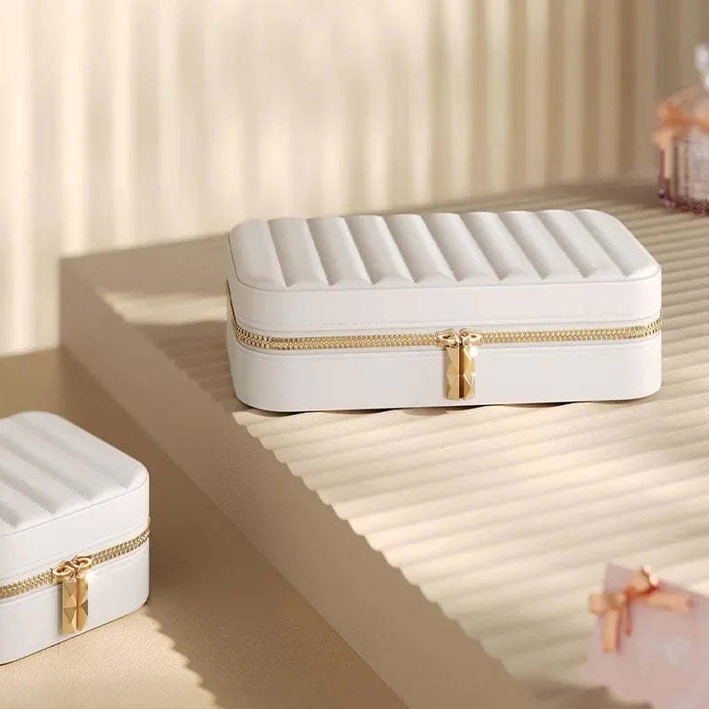 boîte bijoux portable beige simili cuir rayures modernes compartiments miroir fermeture glissière dorée bijoux