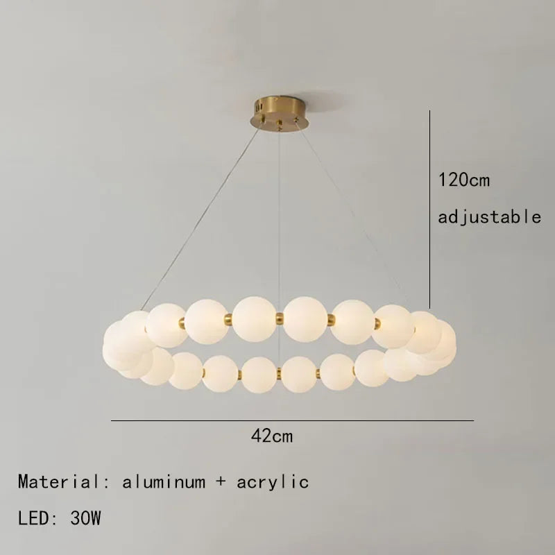 lustre suspension moderne blanc doré boules sphériques chaînes métalliques salon salle manger intérieur