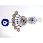 Pendentif oeil turc bleu argenté motifs géométriques artisanal protection maison