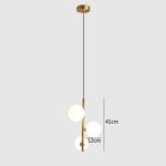 suspension lumineuse moderne sphères translucides barre métallique brillante blanc doré minimaliste chambre salon