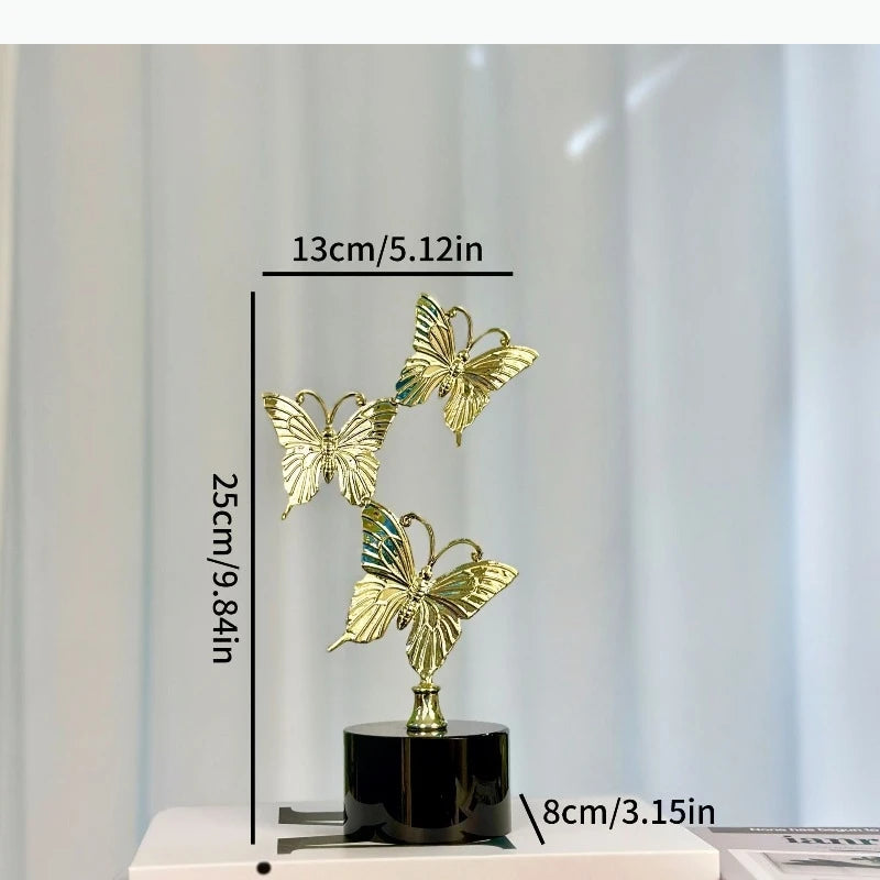 décoration moderne sculpture papillon or brillant base noire élégante maison cadeau
