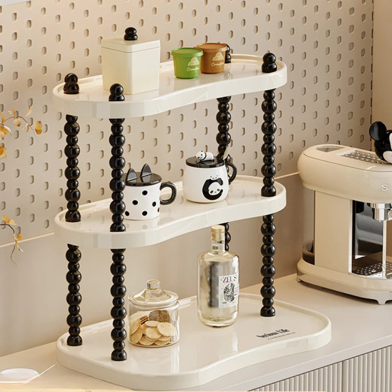 étagère trois niveaux moderne minimaliste blanc noir cosmétiques parfums tasses blancs