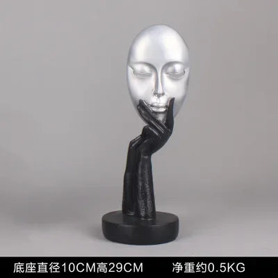 masque sculptural contemporain noir blanc doré finement sculpté base circulaire ornement salon
