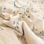 couette d'été légère enfant beige motifs fleurs feuilles coton doux décorative chambre enfant