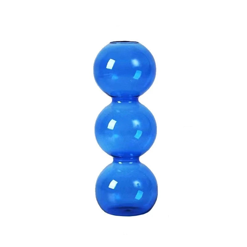 vases transparents modernes sphères empilées bleu vert marron beige