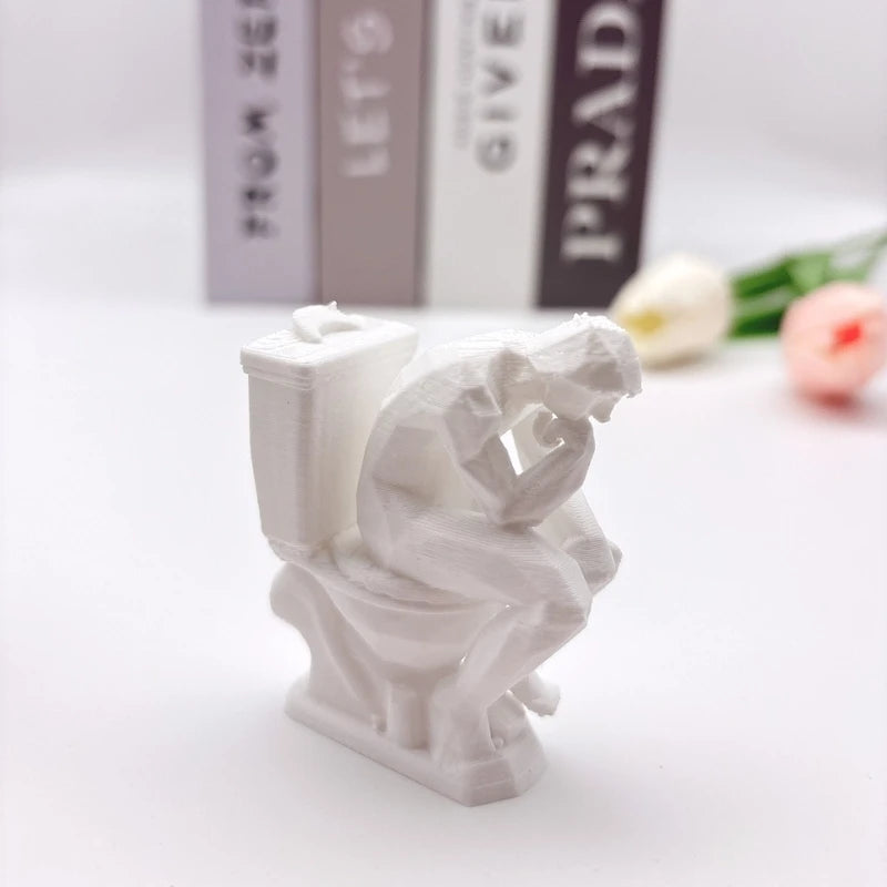 statue humoristique penseur assis toilettes blanc artistique parodie