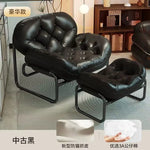 fauteuil cuir moderne noir salon décontracté intérieur chaise relaxation maison contemporaine
