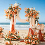 arche décorative boho chic fleurs artificielles orange feuilles vertes franges blanches extérieur mariage anniversaireévénement