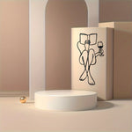 sculpture murale noir silhouette lecture vin minimaliste métal fixations invisibles chambre salon