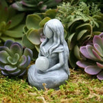 statue méditation femme sphère gris blanche pierreuse sculptée spirituelle intérieure décoration maison