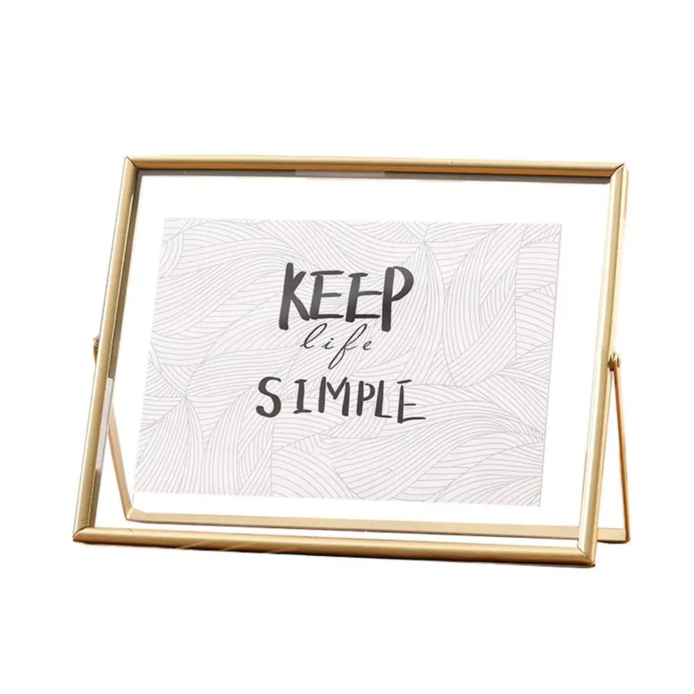 cadre photo moderne minimaliste or noir pieds triangulaires texte simple verre