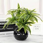 plantes artificielles feuilles striées pot texturé décoration intérieure moderne vert jaune marron gravier