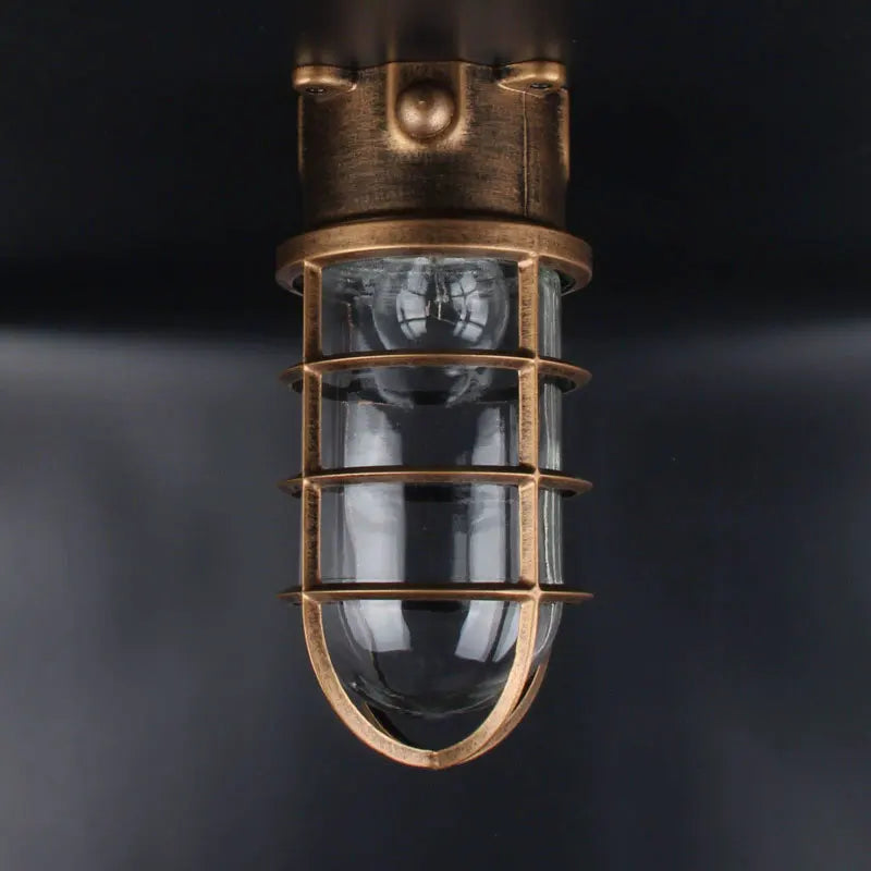 Lampe sécurité industrielle vintage fonte noire bronze bleu clair verre transparent grille métallique