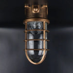 Lampe sécurité industrielle vintage fonte noire bronze bleu clair verre transparent grille métallique