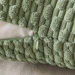 coussins carrés vert clair beige rose pâle texture tissée pompons moderne fermeture glissière