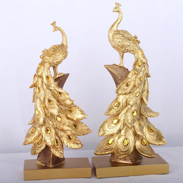 statues oiseaux plumes dorées bleu vert artisanal décoration maison ornement cave vin salon unique