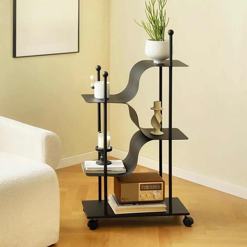 étagère mobile moderne noire courbes fluides contemporaine roulettes plantes objets décoration minimaliste