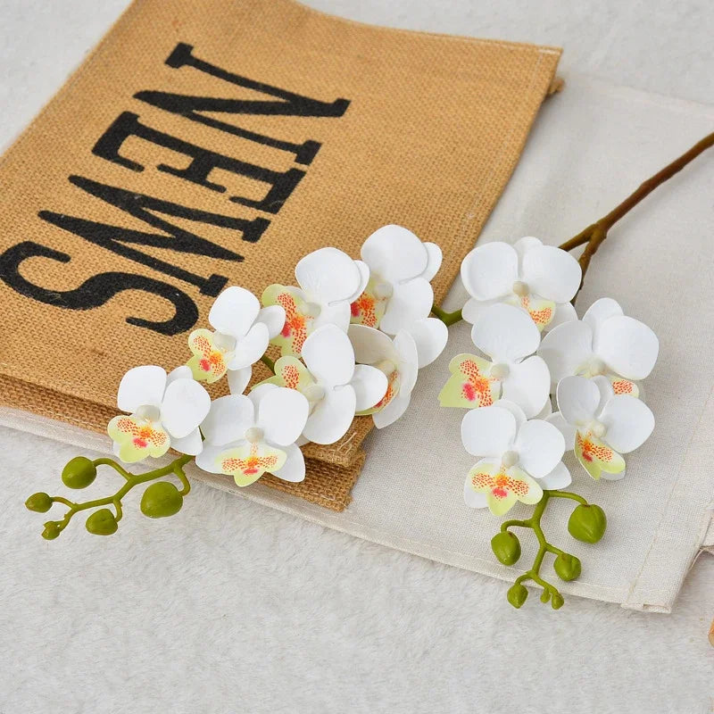 décoration intérieure bouquet orchidée papillon soie blanc rose orange jaune moderne minimaliste