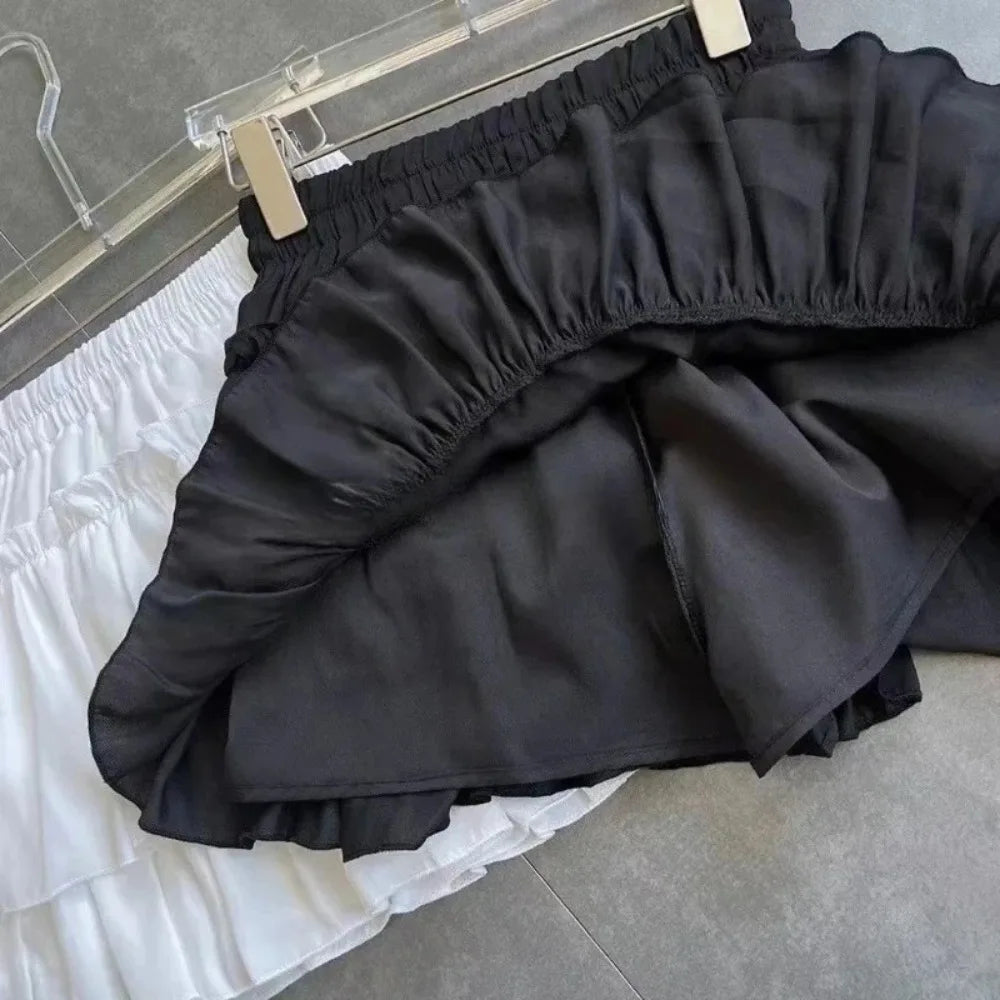 Jupe mini noire blanche rayée plissée classique élégante élastiquée dessus genou été junior femme
