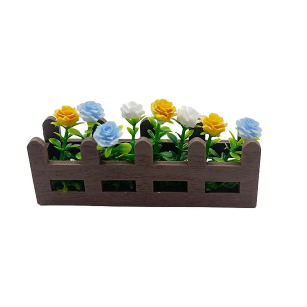 jardin miniature clôture fleurs artificielles feuilles vertes blanc marron rose jaune bleu
