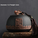 pot thé rouge jaune noir artisanal motifs floraux poisson chaîne pompon hermétique