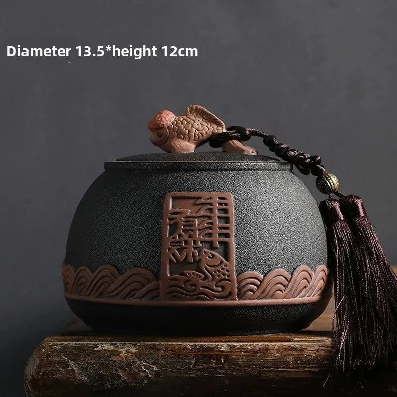 pot thé rouge jaune noir artisanal motifs floraux poisson chaîne pompon hermétique