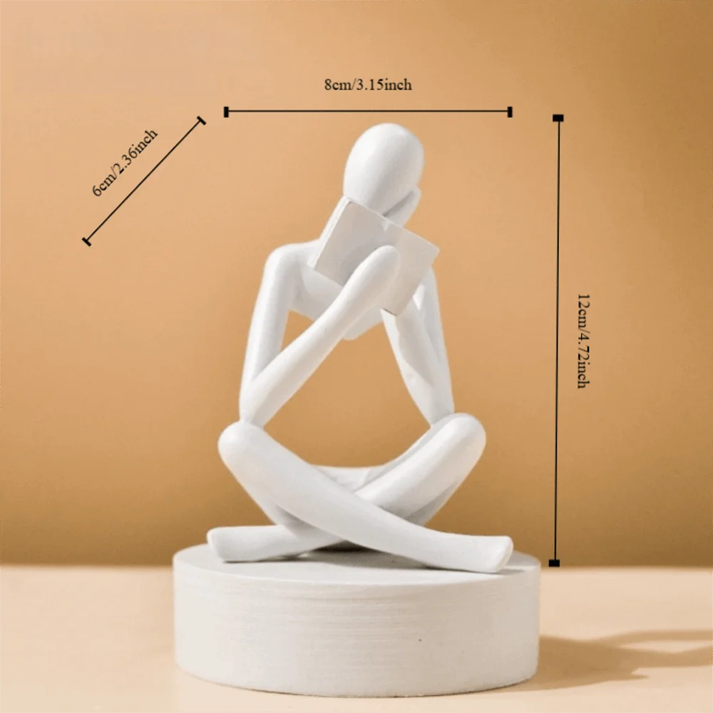 figurine deco moderne or noir blanc personne assise livre socle chambre abstraction minimalisme