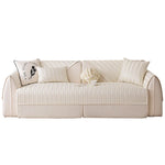 Un canapé confortable et douillet, avec des coussins décoratifs et des motifs texturés, offrant un style élégant et une touche de luxe à votre salon.