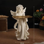 statues anges blanc plateau rangement bougies fleurs séchées décoratives intérieur couronnes roses sculptées