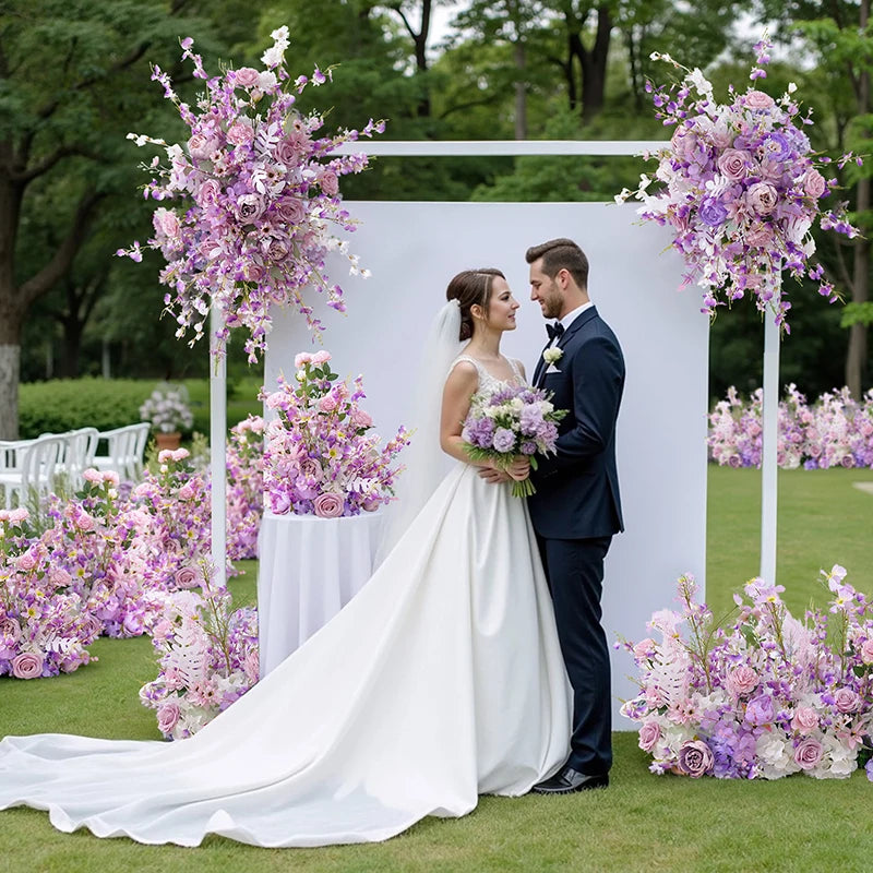 arche mariage fleurs artificielles tissu translucide blanc violet décor romantique extérieur événement table centreDecoration