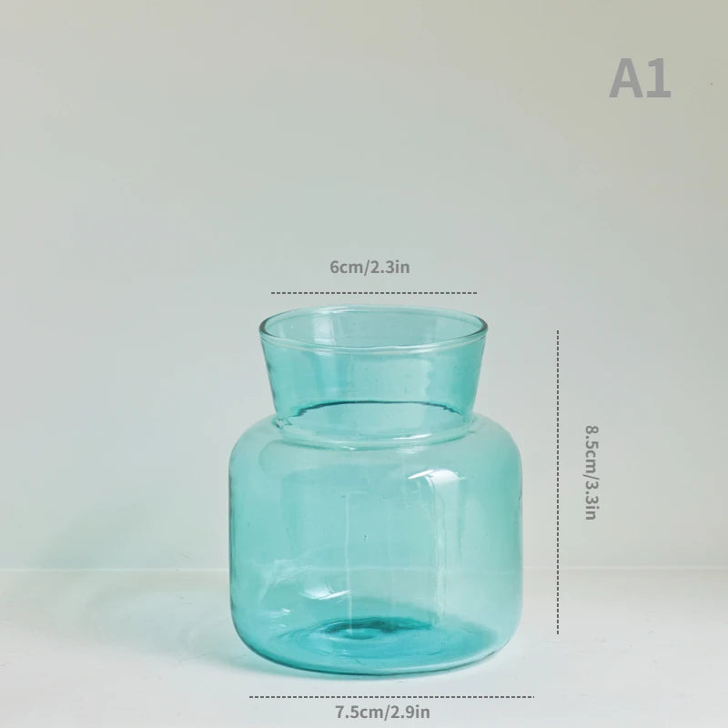 vase table verre transparent moderne fleurs artificielles feuilles bougie décoration intérieure nordique