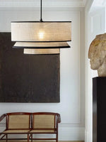 lumière suspendue tissu beige clair texture moderne opacité câble blanc chambre salon