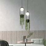 suspension végétale moderne plante artificielle lumière sphère lumineuse noir blanc vert minimaliste