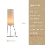 lampe sol moderne led blanc texture rugueuse interrupteur bouton éclairage ambiance chambre salon