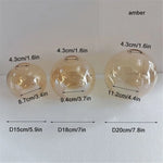 suspension boule verre moderne transparent ambre gris cognac diverse tailles