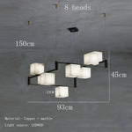 suspension lumineuse moderne marbre noir blanc or rose fixée câbles chambre salon