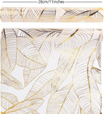nappe moderne élégante feuilles dorées blanc décoration table serviettes assiettes verres