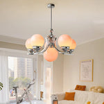 lustre moderne chrome sphères translucides suspension câble led têtes têtes orange