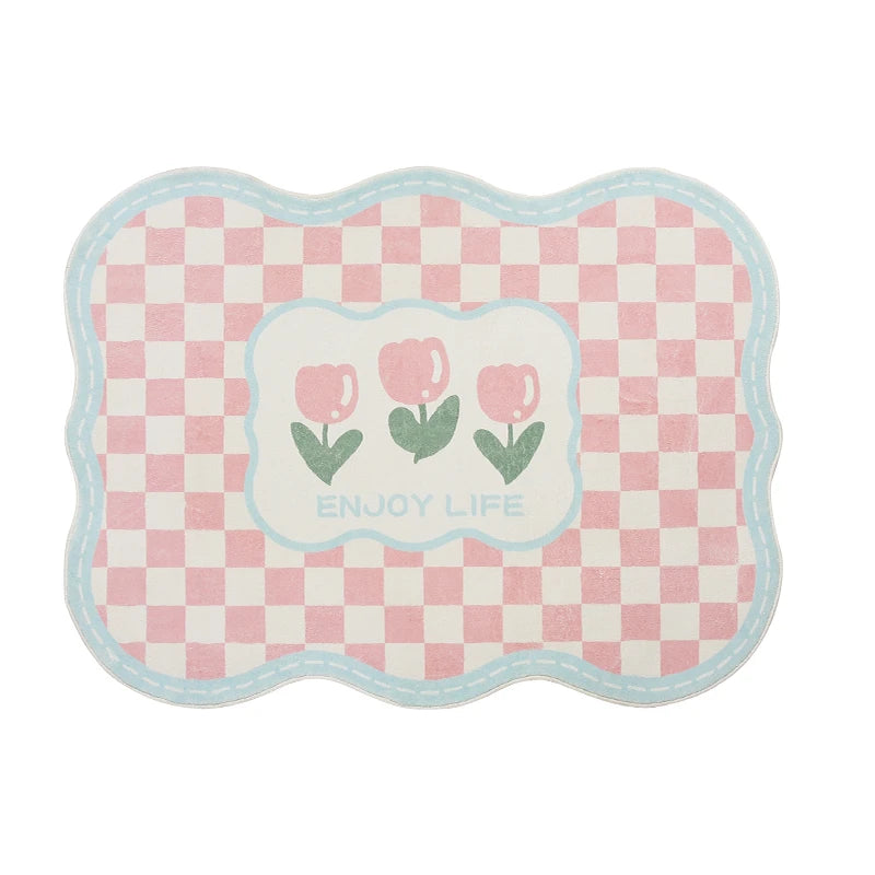 Tapis rose clair et blanc à motif de fleurs et de damier avec le texte "Enjoy life".