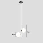 suspension lumineuse moderne sphères translucides barre métallique brillante blanc doré minimaliste chambre salon