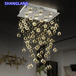 suspension lumineuse moderne transparente cristal brillantes élégante dorée fixations invisibles chaînes incluses