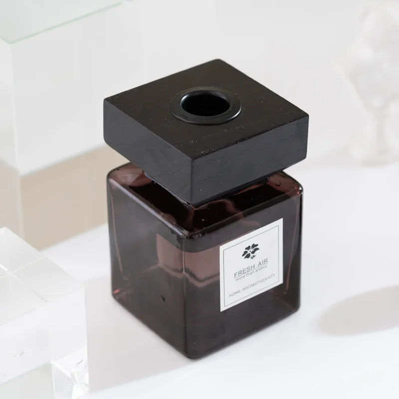 diffuseur d'odeur moderne bâtons parfumés noir brun foncé texture bois opacité rangs bâtonnets aromathérapie