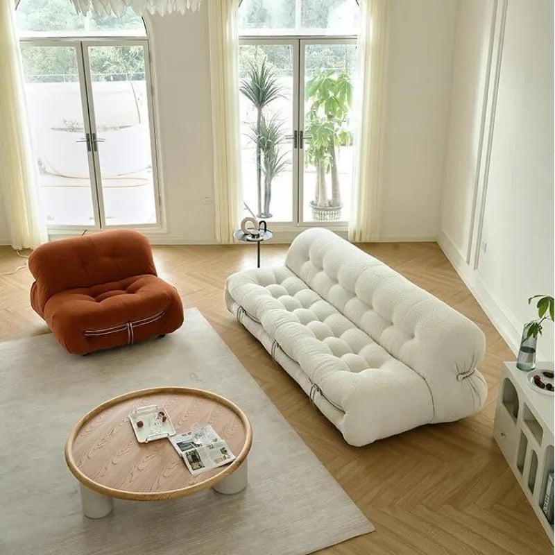 canapé convertible moderne tissu bouclé bois coussins doux beige clair minimaliste éléments scandinaves salon
