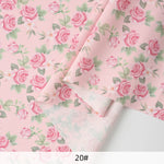 tissu mousseline polyester imprimé fleurs roses fond noir couture robe chemisier rideau diy