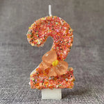 bougie anniversaire chiffre orange paillettes multicolores décoration brillante fleur centroide