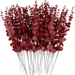vase blanc moderne fleurs artificielles feuilles vertes décoration table intérieure