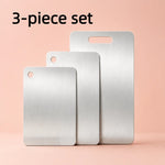 planche découper argentée moderne lisse poignée intégrée minimaliste inoxydable durable cuisine