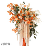 arche décorative boho chic fleurs artificielles orange feuilles vertes franges blanches extérieur mariage anniversaireévénement